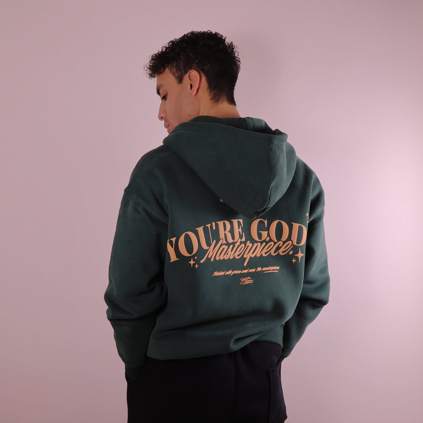 Close - up of 'We Are His Masterpiece' script on a forest green hoodie from We Are Chosen Apparel, inspired by Ephesians 2:10 - wearechosenapparel - 20% off all We Are Chosen Apparel hoodie