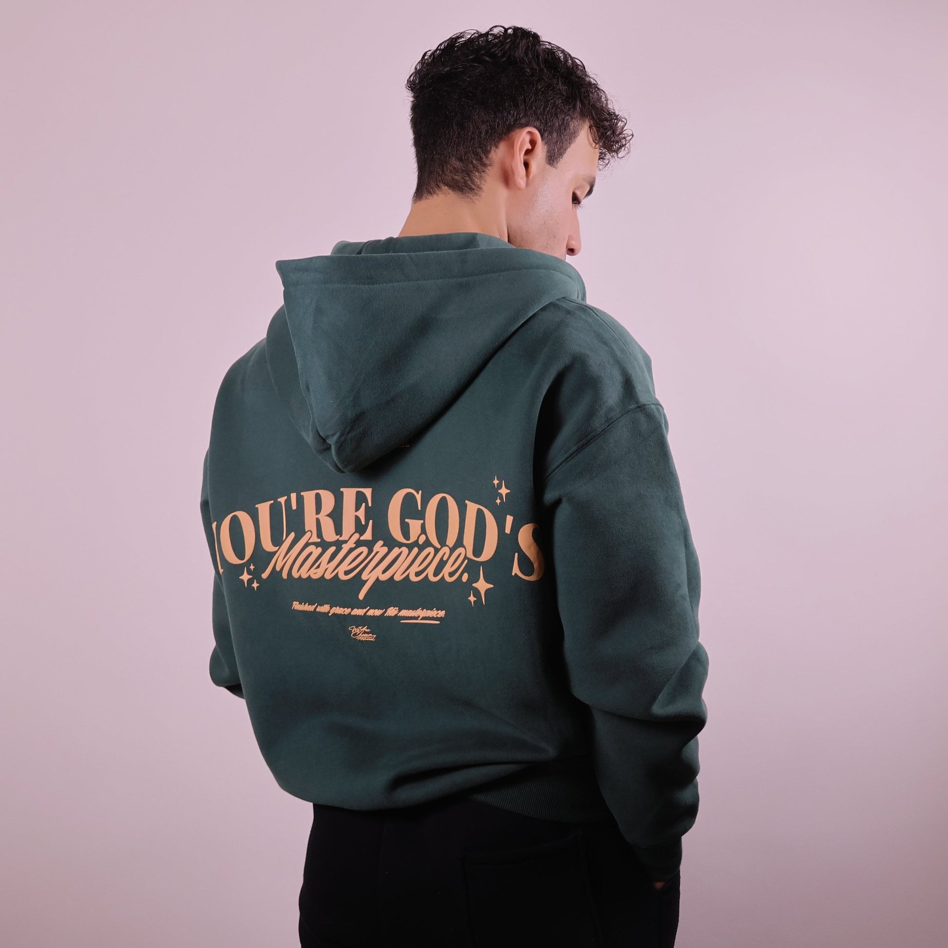 Close - up of 'We Are His Masterpiece' script on a forest green hoodie from We Are Chosen Apparel, inspired by Ephesians 2:10 - wearechosenapparel - 20% off all We Are Chosen Apparel hoodie