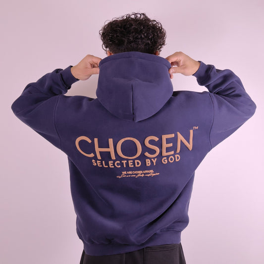 Close-up of ‘We Are His Masterpiece’ script on midnight blue hoodie by We Are Chosen Apparel