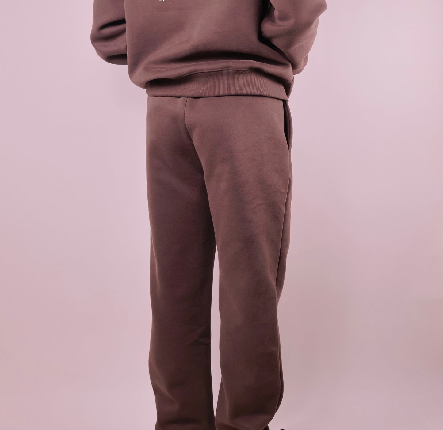 Brown tracksuit on a plain background